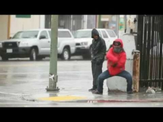 Break Dance by very talent dancers in the rain upon USA's street